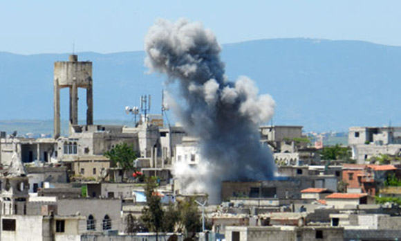 Shelling in Houla in Syria's Homs province. The opposition National Coalition has accused the regime