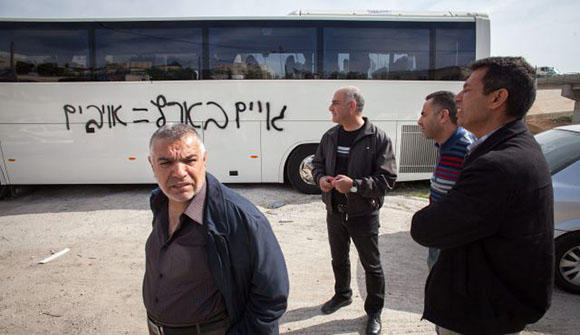 "Goyim = Enemies" reads the spray-painting on a non-Jewish bus in Jerusalem.