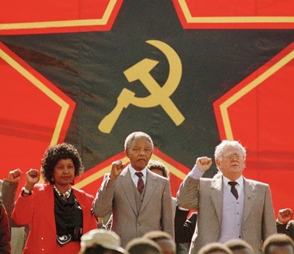 Alongside Mandela in this 1990 photo, is the Jewish Communist and leader of the SACP, Joseph Slovo.