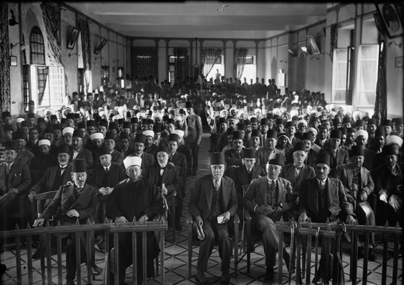A Palestinian protest gathering in session in the Rawdat el Maaref hall, following the 1929 violence.