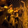 Calais under siege: Riot police battle 2,500 migrants desperate to invade Britain through Channel Tunnel