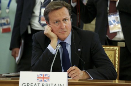 Britain's Prime Minister David Cameron listens to statements during a round table meeting at the G-20 summit in St. Petersburg, Russia on Thursday, Sept. 5, 2013. The threat of missiles over the Mediterranean is weighing on world leaders meeting on the shores of the Baltic this week, and eclipsing economic battles that usually dominate when the G-20 world economies meet. (AP Photo/Sergei Karpukhin, Pool)