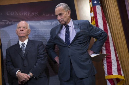 Sen. Charles Schumer, D-N.Y., right, accompanied by Sen. Ben Cardin, D-Md., listens during a news conference about legislation on Iran policy and Middle East security, Thursday, Oct. 1, 2015, on Capitol Hill in Washington. (AP Photo/Evan Vucci)