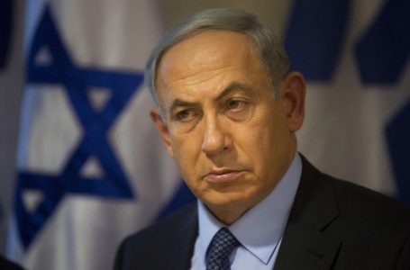 Israeli Prime Minister Benjamin Netanyahu looks on during a press conference at the Foreign Ministry in Jerusalem, Thursday, Oct. 15, 2015. Netanyahu on Thursday said he would be "perfectly open" to meeting with Palestinian President Mahmoud Abbas in order to end weeks of Israeli-Palestinian unrest. (AP Photo/Sebastian Scheiner)