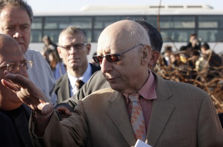British Labour Party lawmaker Gerald Kaufman, right, talks with residents in an area that was destroyed during Israel's January 2009 Gaza offensive in the Jebaliya refugee camp, northern Gaza Strip, Saturday, Jan. 16, 2010. Israelis who authorized the use of white phosphorous in densely populated Gaza should be tried for war crimes, a British Labour Party legislator said Friday, after entering the Hamas-ruled territory with 60 European parliamentarians. Human rights groups have alleged that both Israel and Hamas committed war crimes during Israel's three-week offensive against Gaza, which ended a year ago. (AP Photo/Hatem Moussa)